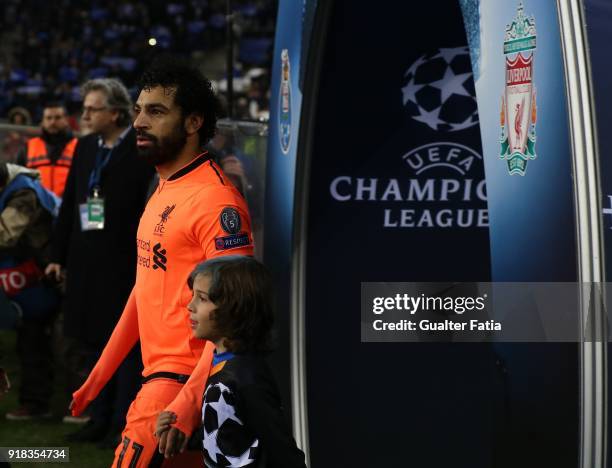 Liverpool forward Mohamed Salah from Egypt entering the pitch before the start of the UEFA Champions League Round of 16 - First Leg match between FC...