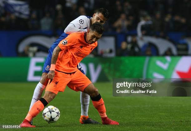 Liverpool forward Roberto Firmino from Brazil with FC Porto defender Diego Reyes from Mexico in action during the UEFA Champions League Round of 16 -...