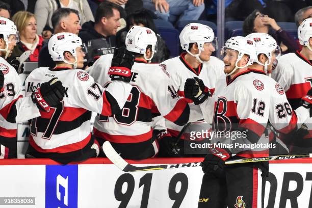 Jack Rodewald of the Belleville Senators celebrates his first period goal with teammates on the bench against the Laval Rocket during the AHL game at...