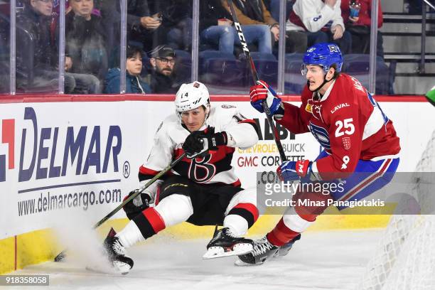 Michael McCarron of the Laval Rocket takes down Jim O'Brien of the Belleville Senators during the AHL game at Place Bell on February 14, 2018 in...