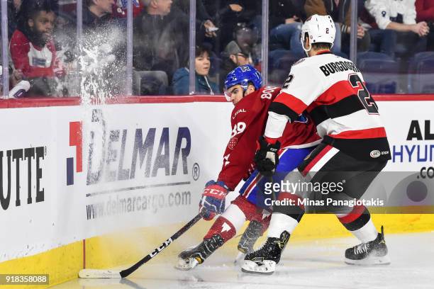 Erik Burgdoerfer of the Belleville Senators challenges Jordan Boucher of the Laval Rocket during the AHL game at Place Bell on February 14, 2018 in...