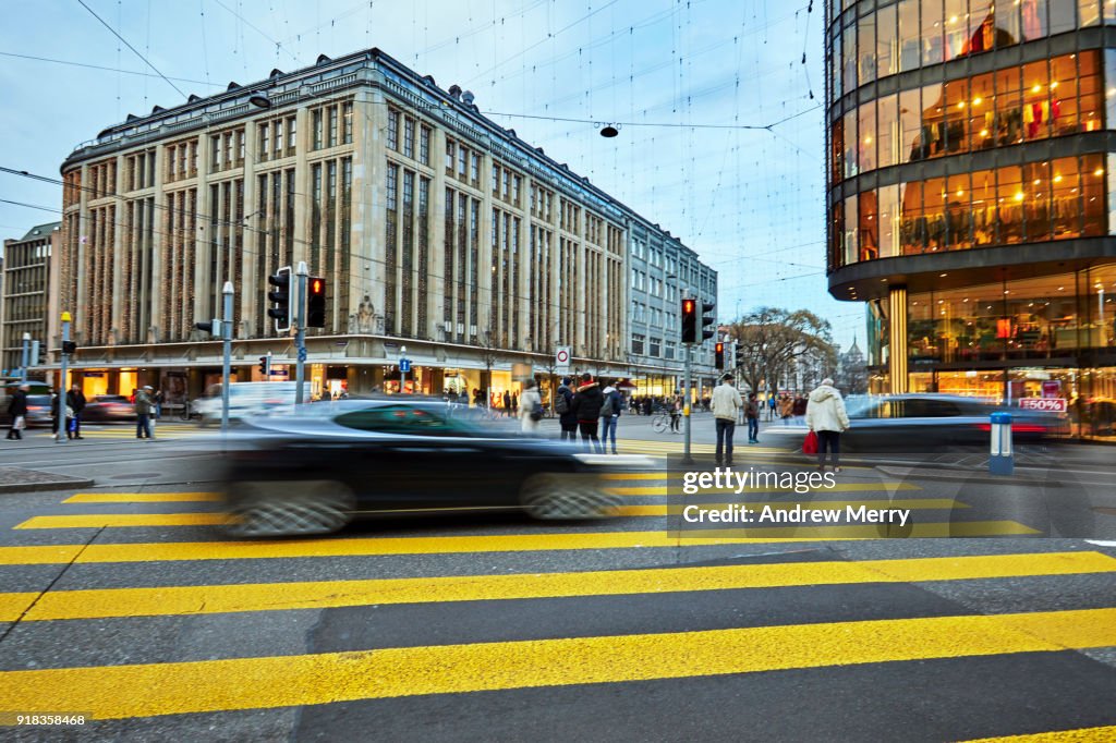 Pedestrian crossing with electric car on the corner of Bahnhofstrasse and Uraniastrasse, Zurich, Switzerland