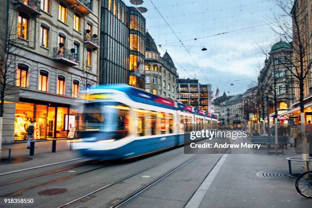 swiss tram, cable car early evening on bahnhofstrasse, zurich, switzerland - zürich bildbanksfoton och bilder