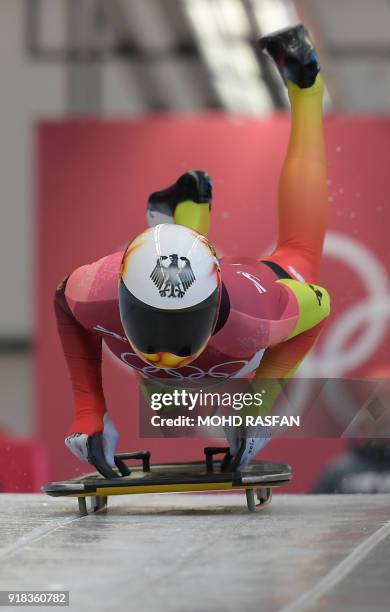 Germany's Axel Jungk jumps onto the sled in the mens's skeleton heat 1 during the Pyeongchang 2018 Winter Olympic Games, at the Olympic Sliding...