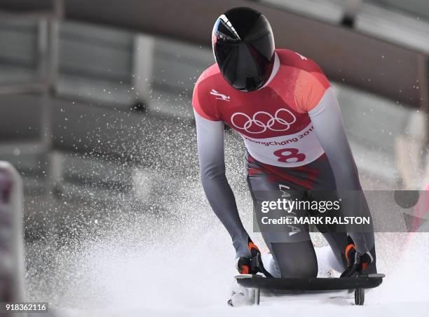Latvia's Tomass Dukurs slows down at the end of the mens's skeleton heat 1 during the Pyeongchang 2018 Winter Olympic Games, at the Olympic Sliding...