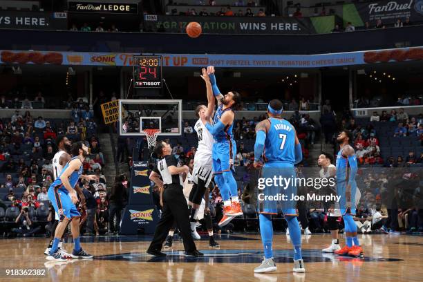 Steven Adams of the Oklahoma City Thunder and Marc Gasol of the Memphis Grizzlies tip off at the start of the game on February 14, 2018 at FedExForum...