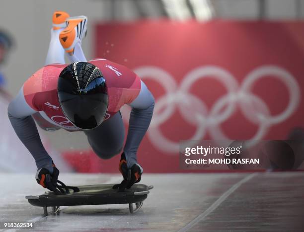 Latvia's Tomass Dukurs competes in the mens's skeleton heat 1 during the Pyeongchang 2018 Winter Olympic Games, at the Olympic Sliding Centre on...