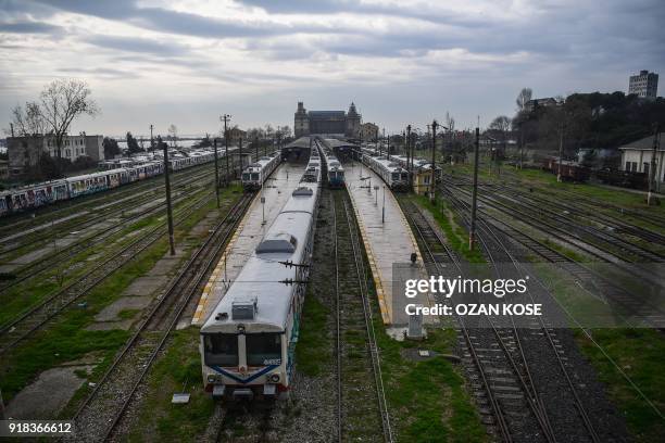 Picture taken on January 15, 2018 shows scrap trains decorated with graffitis at the Haydarpasa train station in Istanbul. Built in the first decade...