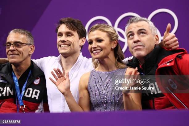 Kirsten Moore-Towers and Michael Marinaro of Canada react to their scores after competing during the Pair Skating Free Skating at Gangneung Ice Arena...