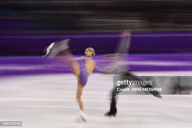 This slow shutter speed exposure shows USA's Alexa Scimeca Knierim and USA's Chris Knierim competing in the pair skating free skating of the figure...