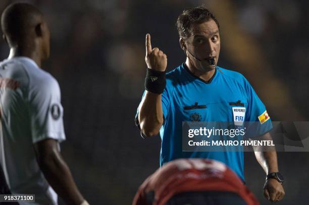 Argentine referee Fernando Andres Rapallini gestures during the Libertadores Cup football match between Brazil's team Vasco da Gama and Bolivia's...