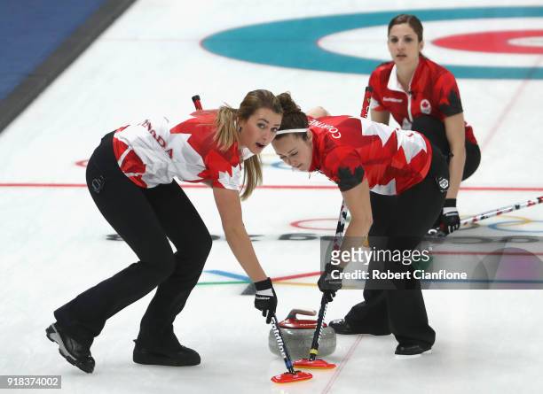 Emma Miskew, Joanne Courtney and Lisa Weagle of Canada compete during the Curling Women's Round Robin Session 2 held at Gangneung Curling Centre on...