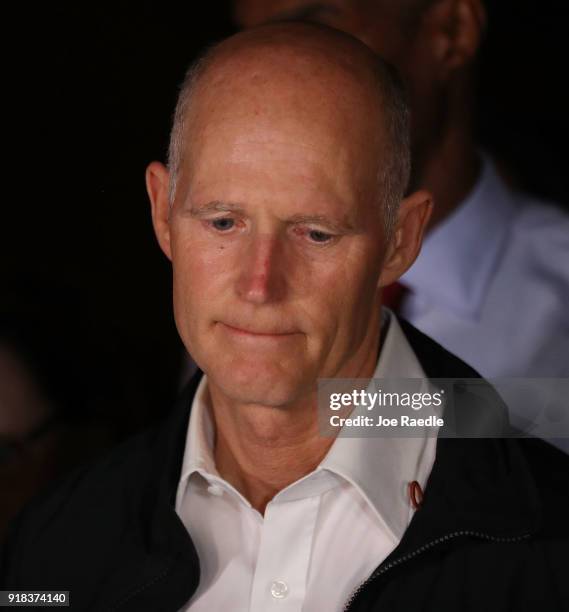 Florida Governor Rick Scott speaks to the media as he visits Marjory Stoneman Douglas High School after a shooting at the school killed 17 people on...