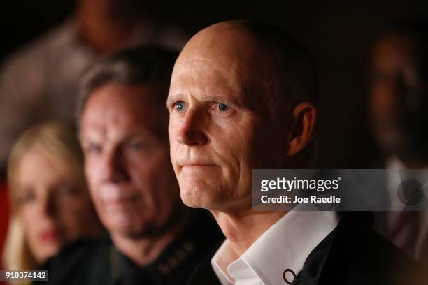 Florida Governor Rick Scott speaks to the media as he visits Marjory Stoneman Douglas High School after a shooting at the school killed 17 people on...