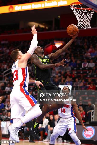 Malcolm Delaney of the Atlanta Hawks drives to the basket paste Blake Griffin of the Detroit Pistons during the second half at Little Caesars Arena...
