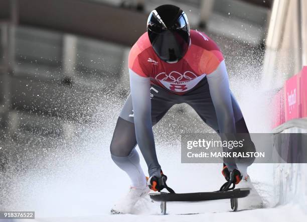 Latvia's Tomass Dukurs slows down at the end of the mens's skeleton heat 2 during the Pyeongchang 2018 Winter Olympic Games, at the Olympic Sliding...