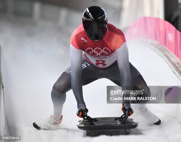 Latvia's Tomass Dukurs slows down at the end of the mens's skeleton heat 2 during the Pyeongchang 2018 Winter Olympic Games, at the Olympic Sliding...
