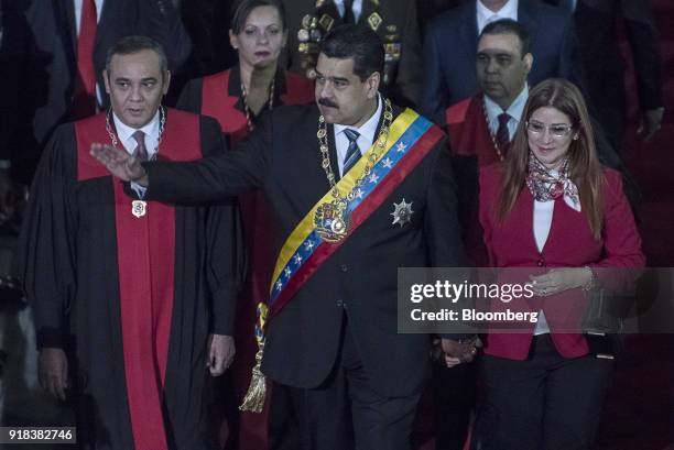 Nicolas Maduro, Venezuela's president, center, waves as he arrives with Cilia Flores, Venezuela's first lady, right, and Maikel Moreno, Venezuela's...