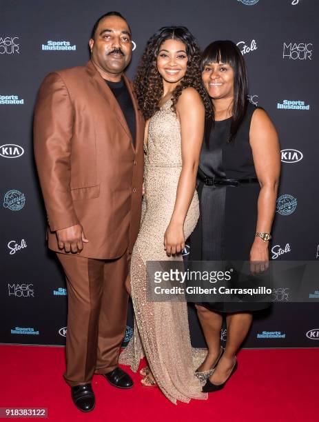 Sports Illustrated Swimsuit cover model Danielle Herrington poses with her parents Darryl Herrington and Theresa Herrington during the 2018 Sports...