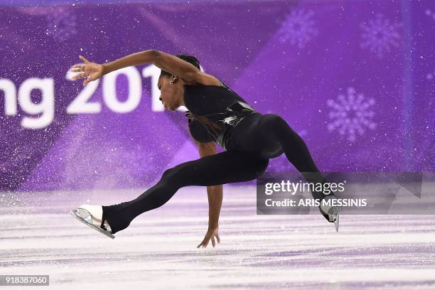 France's Vanessa James falls as she and partner France's Morgan Cipres compete in the pair skating free skating of the figure skating event during...