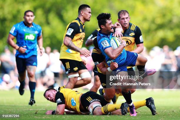 Melani Nanai of the Blues is brought down during the Super Rugby trial match between the Blues and the Hurricanes at Mahurangi Rugby Club on February...