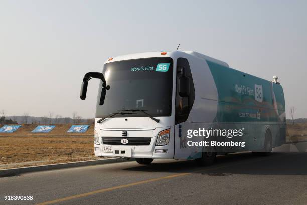 An autonomous 5G connected bus, operated by KT Corp., travels along a road during a media event in Gangneung, Gangwon Province, South Korea, on...