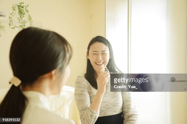 young woman's aromatherapist counseling patient - essence day stock pictures, royalty-free photos & images