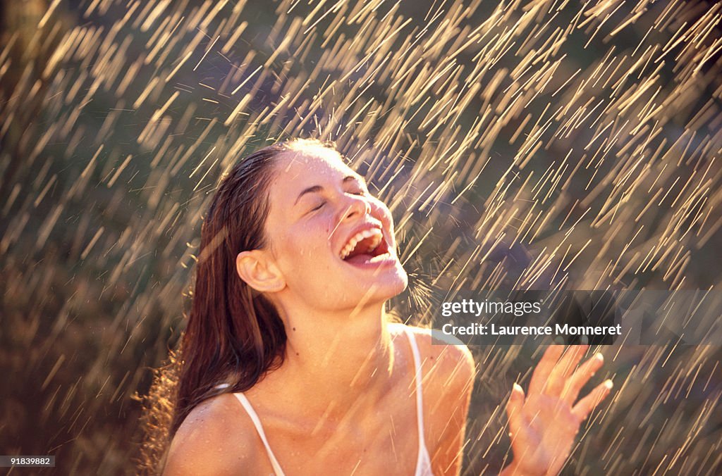 Woman Being Sprayed With Water High-Res Stock Photo - Getty Images