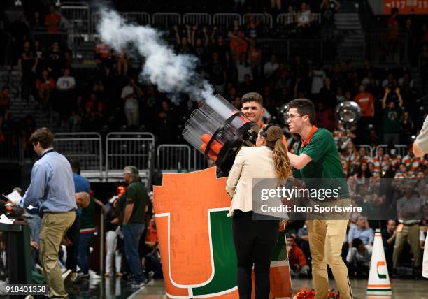 Miami game promotion people fire tee shirts into the crowd during a college basketball game between the University of Virginia Cavaliers and the...