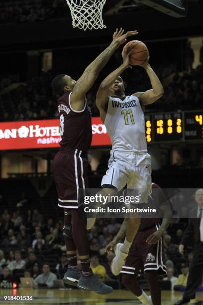 Vanderbilt Commodores guard Jeff Roberson drives for a layup past Mississippi State Bulldogs guard Xavian Stapleton during a Southeastern Conference...