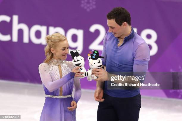 Gold medal winners Aljona Savchenko and Bruno Massot of Germany celebrate during the victory ceremony after the Pair Skating Free Skating at...