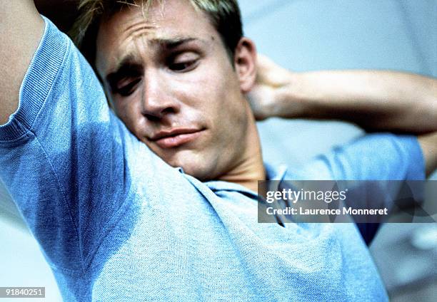 man with sweat under arms - armpit stock pictures, royalty-free photos & images