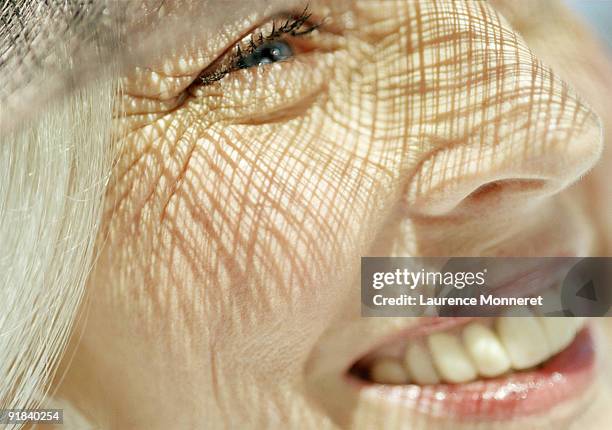 smiling woman - women wrinkle stockfoto's en -beelden