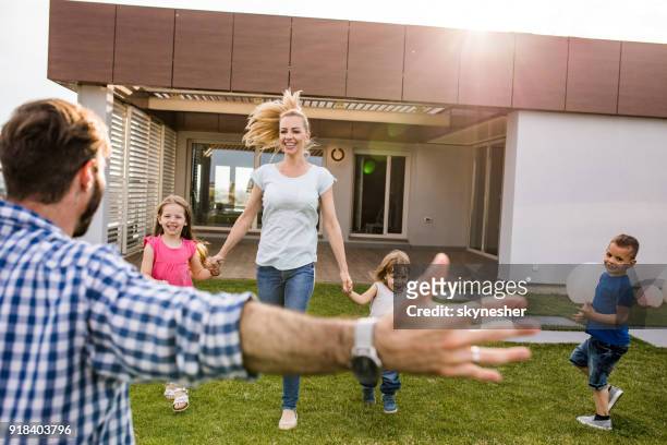 let's run to daddy's hug! - penthouse girl stock pictures, royalty-free photos & images