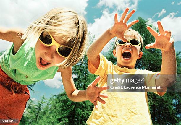 playful children wearing sunglasses - enf stock pictures, royalty-free photos & images