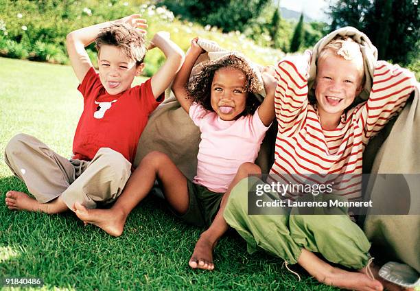 children sticking out tongues - blonde girl sticking out her tongue stock pictures, royalty-free photos & images