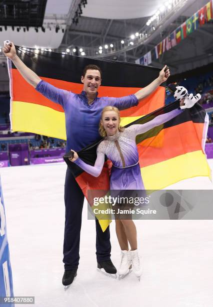 Gold medal winners Aljona Savchenko and Bruno Massot of Germany celebrate during the victory ceremony after the Pair Skating Free Skating at...