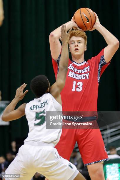 Detroit Titans forward Jack Ballantyne looks to pass as Cleveland State Vikings Tyree Appleby defends during the first half of the men's college...