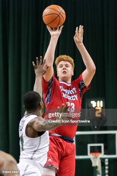 Detroit Titans forward Jack Ballantyne shoots over Cleveland State Vikings Terrell Hales during the first half of the men's college basketball game...