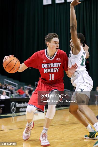 Detroit Titans forward Cole Long is defended by Cleveland State Vikings Bobby Word during the first half of the men's college basketball game between...