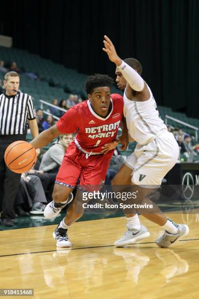 Detroit Titans guard Jermaine Jackson Jr. Is defended by Cleveland State Vikings Kasheem Thomas during the first half of the men's college basketball...