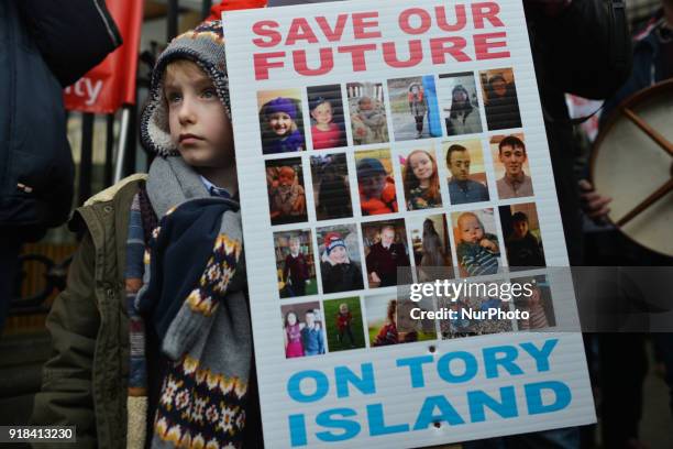 Seven year old Padraig Carroll among other people from mainly Irish-speaking Tory Island protest outside Leinster House in Dublin against the...