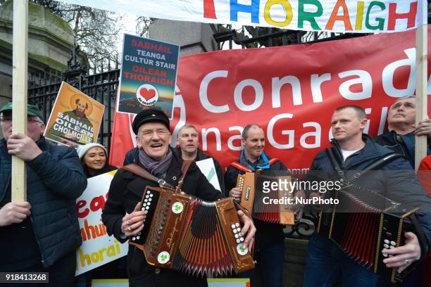 People from mainly Irish-speaking Tory Island protest outside Leinster House in Dublin against the government's decision to award a contract for a...