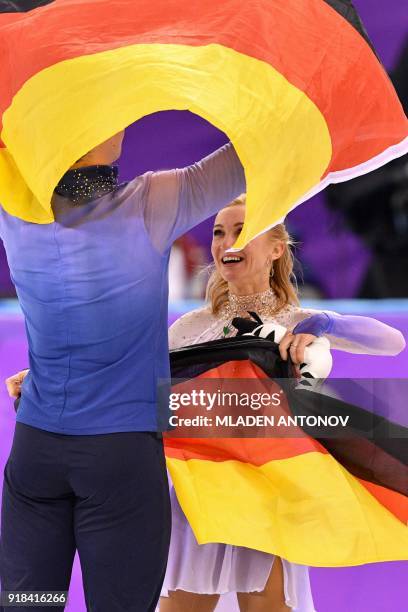 Gold winners Germany's Aljona Savchenko and Germany's Bruno Massot celebrate following the pair skating free skating of the figure skating event...