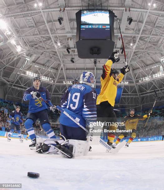 Frank Hordler of Germany scores at 1:51 of the third period against Mikko Koskinen of Finland during the Men's Ice Hockey Preliminary Round Group C...