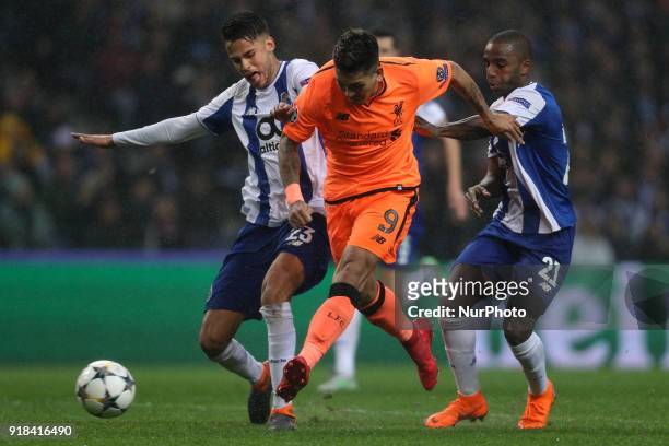 Roberto Firmino forward of Liverpool in action with Porto's Portuguese defender Ricardo Pereira and Porto's Mexican defender Diego Reyes during the...