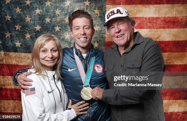 Gold medalist in the Men's Snowboard Halfpipe Shaun White of the United States poses for a portrait with his parents Cathy White and Roger White on...