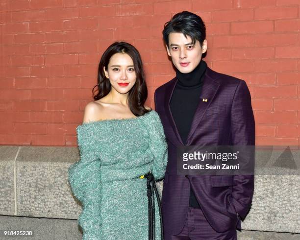 Huang Yilin and Dylan Kuo attend the Marc Jacobs Fall 2018 fashion show during New York Fashion Week at Park Avenue Armory on February 14, 2018 in...