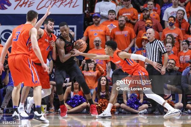 Forward Brandon McCoy of the UNLV Rebels finds himself surrounded by forward Zach Haney and guard Chandler Hutchison of the Boise State Broncos...
