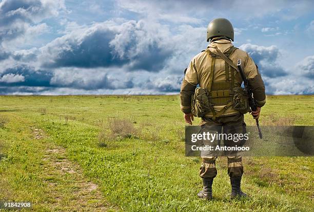 the lonely soldier - kalasjnikov stockfoto's en -beelden